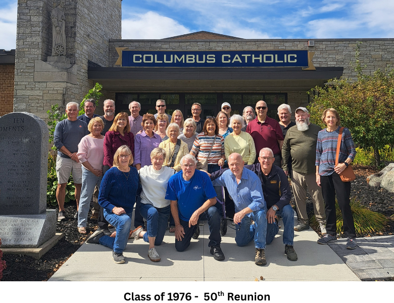 Members of the Columbus Catholic Class of 1976 pose outside the school&rsquo;s main entrance